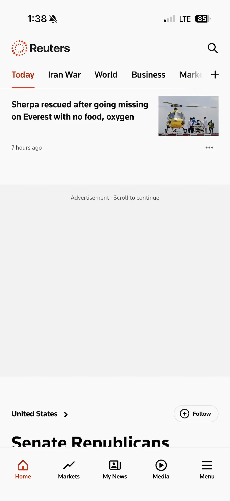 a screenshot of the Reuters iOS app with ads blocked and just showing a grey rectangle with the word