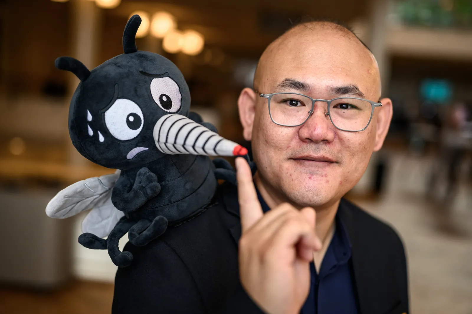 Canadian Associate Professor Changhong Cao poses with a fake moskito ahead of the 2026 Ig Nobel Prize Ceremony in Zurich...